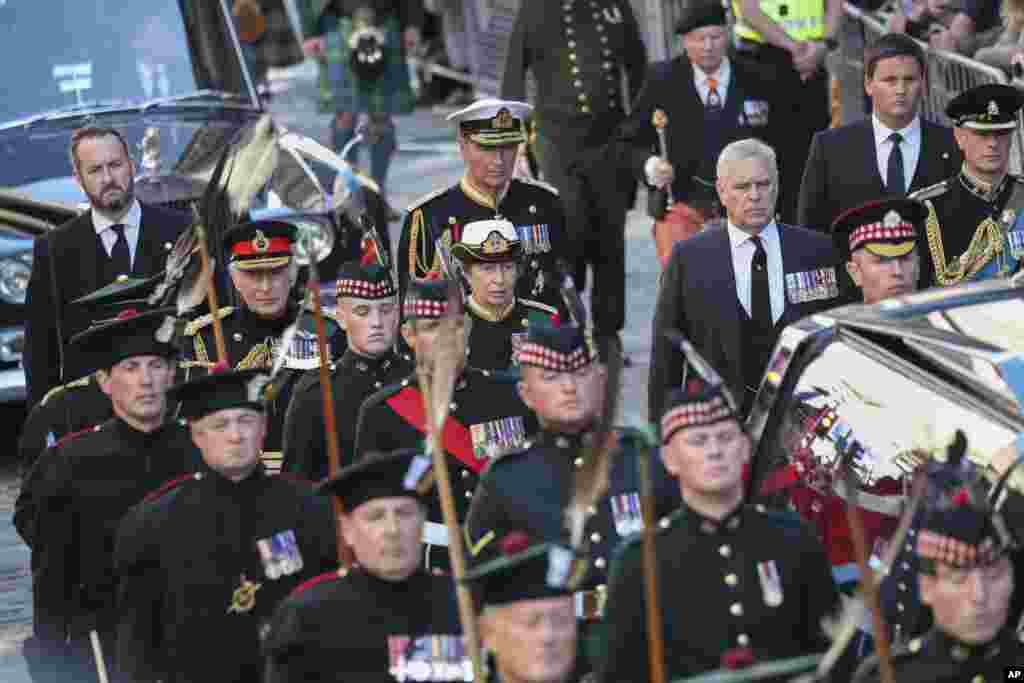 King Charles III, the Princess Royal, the Duke of York and the Earl of Wessex walk behind the hearse carrying the coffin of Queen Elizabeth II, in Edinburgh, heading up the Royal Mile to St. Giles' Cathedral, Sept. 12, 2022.
