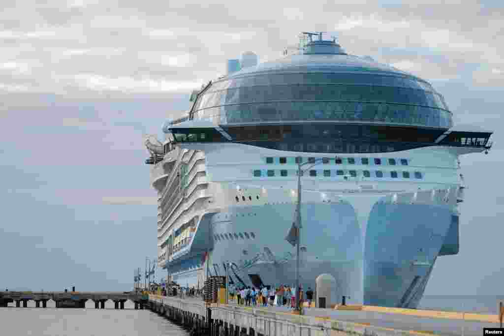 Tourists leave the Royal Caribbean's Icon of the Seas, the largest cruise ship in the world, after arriving at Costa Maya Cruise Port, in the village town of Mahahual, Quintana Roo state, Mexico, Feb. 6, 2024.