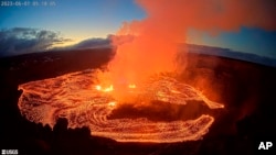 In this webcam image provided by the US Geological Survey, an eruption takes place on the summit of the Kilauea volcano in Hawaii, June 7, 2023. 