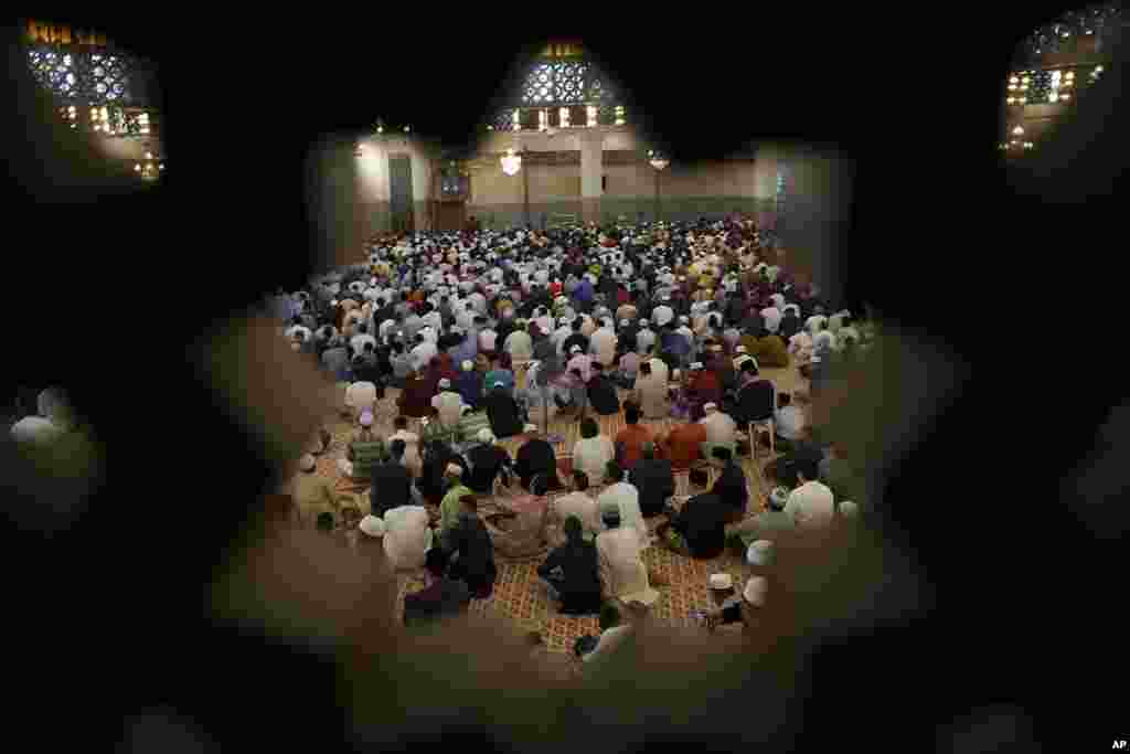 Muslims attend prayers at National Mosque for the Eid al-Fitr, marking the end the holy fasting month of Ramadan in Kuala Lumpur, Malaysia.