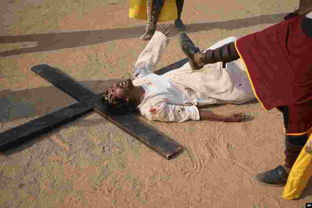 Christians reenact the crucifixion of Jesus Christ to mark Good Friday at Holy Family Church in Hyderabad, India.