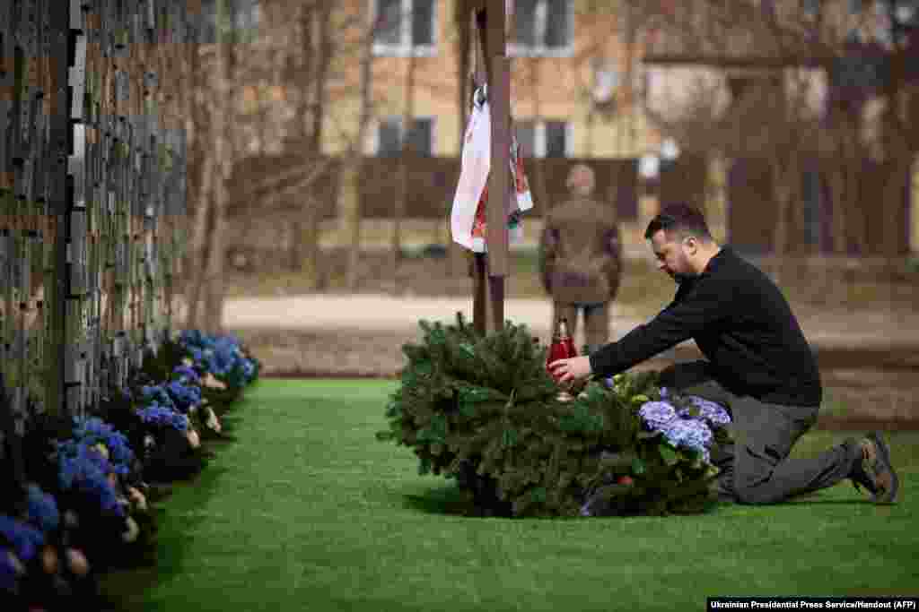 Ukraine's President Volodymyr Zelensky honors the memory of the victims of the Russian occupation at a memorial in the town of Bucha.