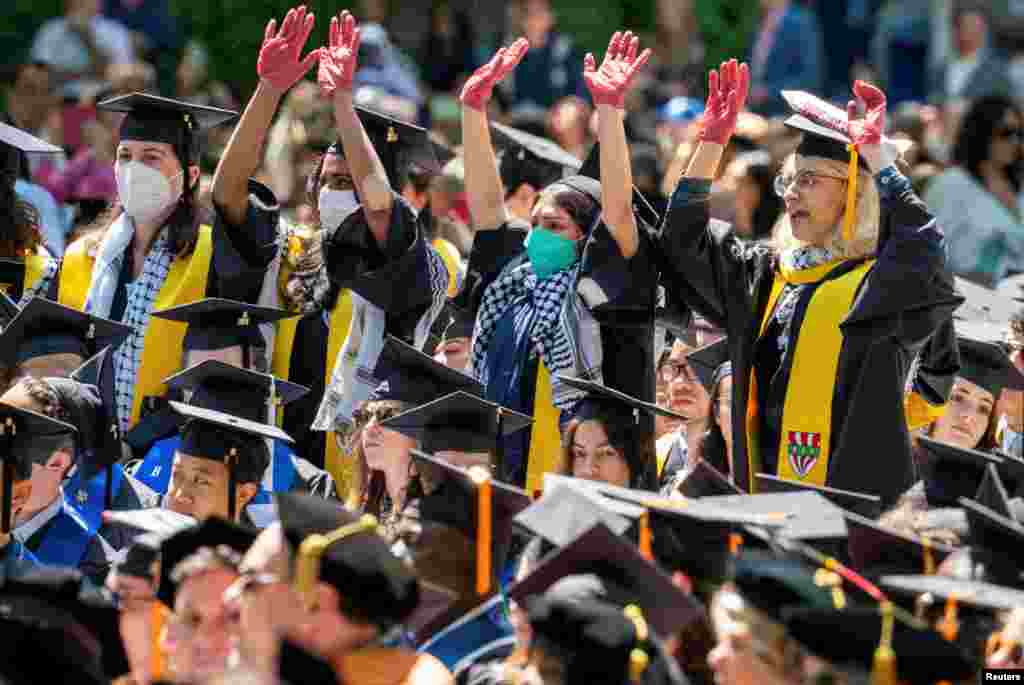 Graduates protest the conflict between Israel and the Palestinian Islamist group Hamas, during the commencement at Yale University in New Haven, Connecticut.