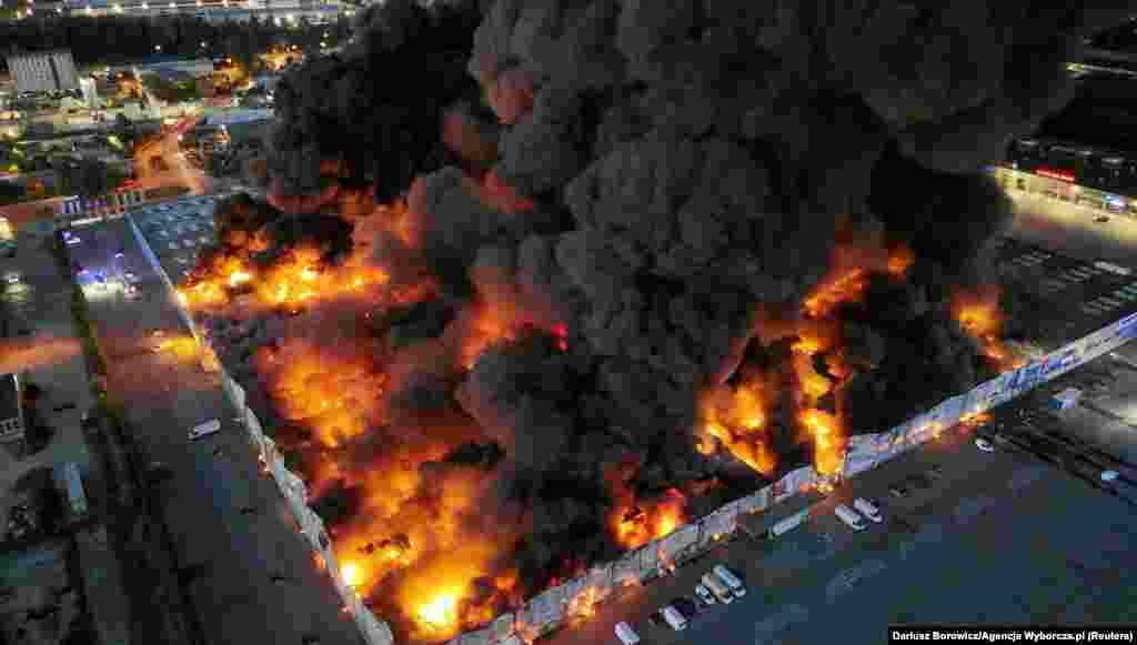 Drone view of the Marywilska 44 shopping centre burning during a massive fire in Warsaw, Poland.