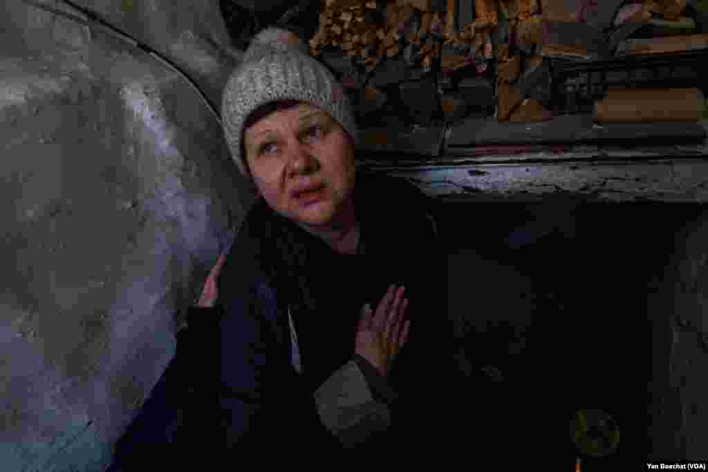 Helena Kasmina, 53, takes cover in her cellar during Russian bombardment in her village, in Netailove, March 8, 2024. Helena, like many here, has decided it is time to leave for a safer place.