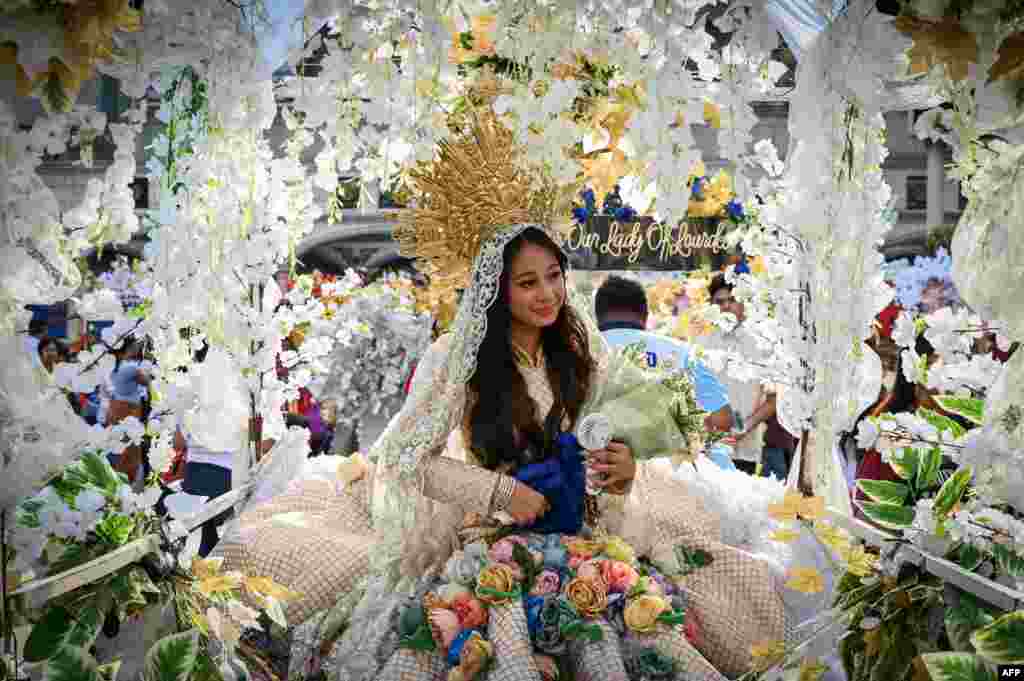 A woman participates in Santacruzan, an annual parade that celebrates the Holy Cross, in Manila.