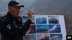 Nefi de Aquino, a police officer who keeps an eye on the activity of the Popocatepetl volcano for scientists, speaks during an interview in Santiago Xalitzintla, Mexico, May 25, 2023. 