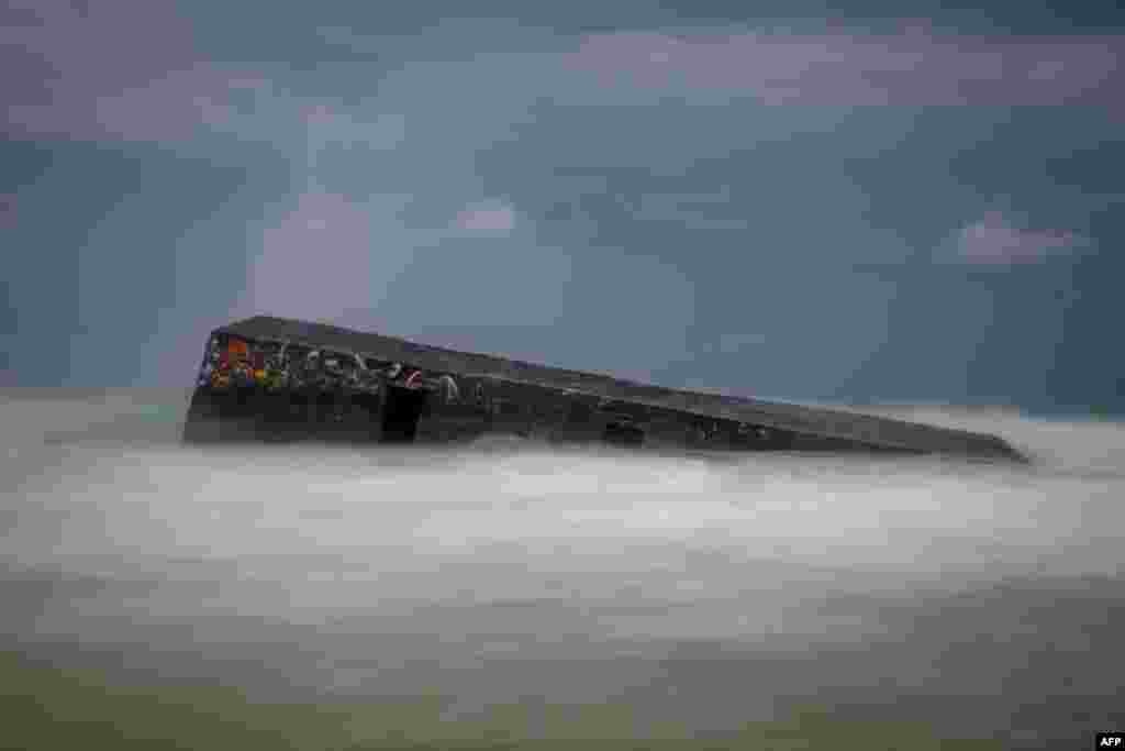 This photograph shows a partially submerged bunker (Blockhaus) from the Atlantic Wall at the entrance of Arcachon Bay near Cap Ferret, south-western France. The Atlantic Wall, made up of bunkers or blockhaus was ordered by Nazi Germany's leader Adolf Hitler to be built between 1942 and 1944, stretched some 5000km from northern Norway to the Franco-Spanish border to defend occupied territories from sea borne attack. 