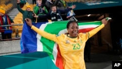South Africa's Wendy Shongwe celebrates with the national flag after the Women's World Cup Group G soccer match between South Africa and Italy in Wellington, New Zealand, Aug. 2, 2023. 