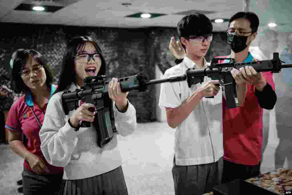 Students learn how to use an airsoft gun from Taiwanese military instructors at Kaohsiung Municipal Sanmin Senior High School in Kaohsiung, Taiwan. Kaohsiung City launched a national defense education program using digital technology for all its high school students. 