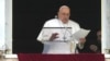 Pope Francis reads his message during the Angelus noon prayer from the window of his studio overlooking St. Peter's Square, at the Vatican, March 10, 2024.