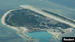 Pemandangan udara menunjukkan Pulau Thitu yang diduduki Filipina, yang secara lokal dikenal sebagai Pag-asa, di Kepulauan Spratly yang disengketakan, Laut China Selatan, 9 Maret 2023. (Foto: REUTERS/Eloisa Lopez)