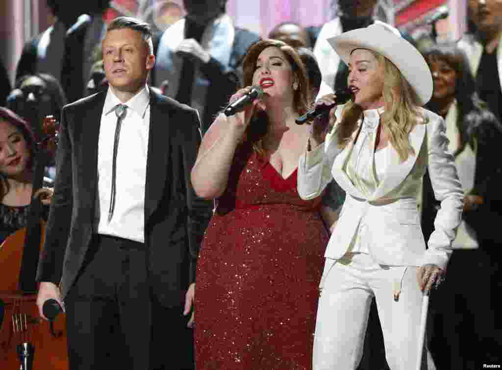Mary Lambert and Madonna perform "Same Love" by Ryan Lewis and Macklemore at the 56th annual Grammy Awards in Los Angeles, Jan. 26, 2014.