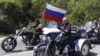 ARHIVA - Ruski predsednik Vladimir Putin na Harli Dejvidsonu (Foto: AP/Sergei Karpukhin/Pool)