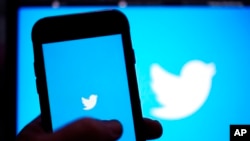 FILE - The Twitter application is seen on a digital device, April 25, 2022, in San Diego.