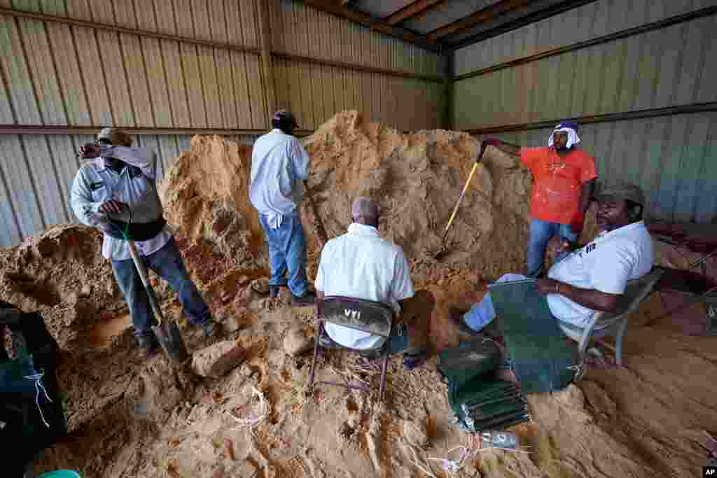 Municipal workers fill sandbags for residents in advance of Hurricane Laura in Abbeville, La., Aug. 25, 2020.