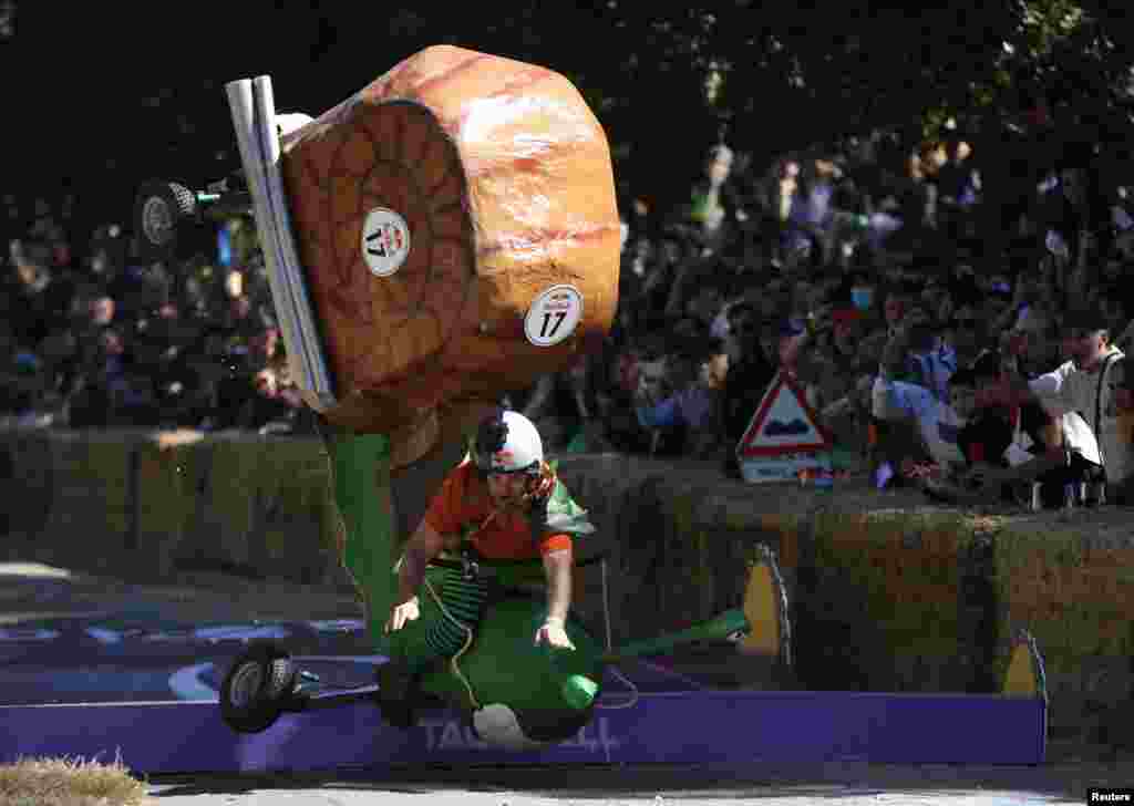 A competitor drives his homemade vehicle without an engine during the Red Bull Soapbox Race in Madrid, Spain.