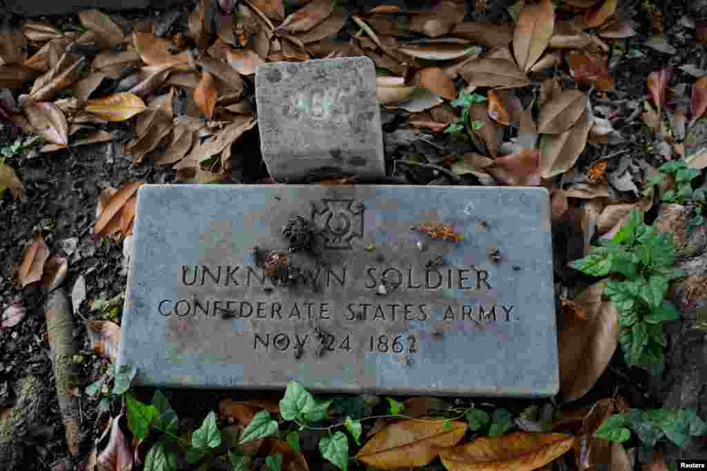 A stone marks the grave of an unknown Confederate States Army soldier from the U.S. Civil War at the Elmwood Cemetery in Memphis, Tennessee, Aug. 22, 2017.