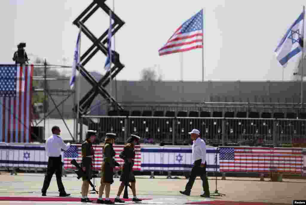 Israeli soldiers walk towards their positions as they prepare for an official ceremony to welcome President Obama at Ben Gurion International Airport, near Tel Aviv, Israel, March 20, 2013.