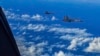 In this photo released by Xinhua News Agency, fighter jets of the Eastern Theater Command of the Chinese People's Liberation Army conduct a joint combat training exercises around the Taiwan Island, Aug. 7, 2022. (Gong Yulong/Xinhua via AP)