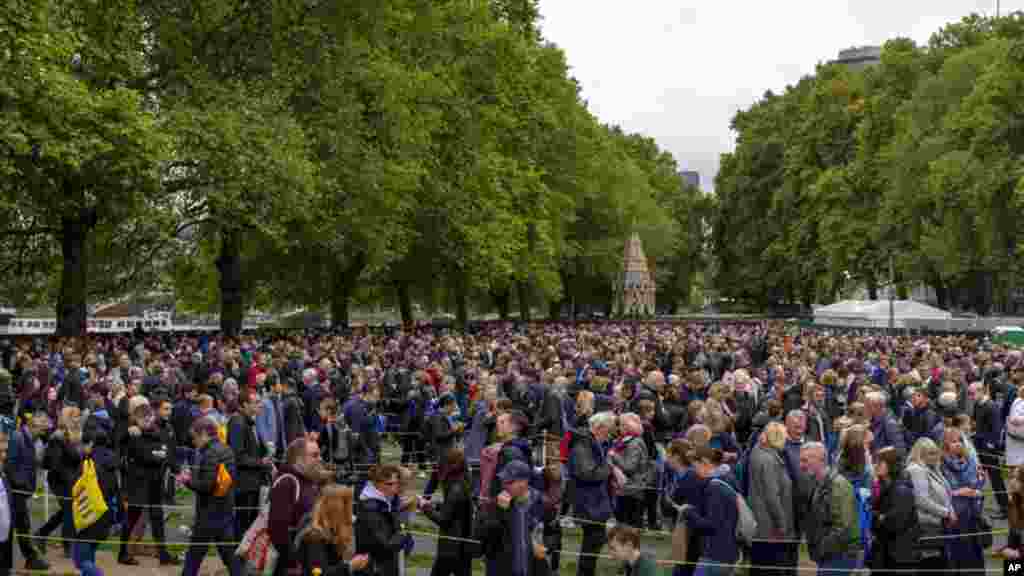 People queue to pay their respects to the late Queen Elizabeth II, outside Westminster Hall in London.