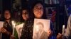 Members of the Japan information and study center hold a candlelight vigil to pay tribute to the late former prime minister of Japan, Shinzo Abe, at Ahmedabad Management Association in Ahmedabad, India, July 9, 2022.
