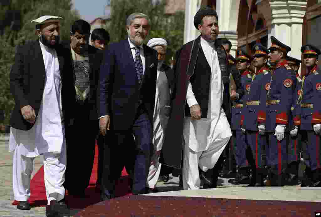 Chief Executive Abdullah Abdullah (center) arrives for an inauguration ceremony at the presidential palace in Kabul, Sept. 29, 2014.
