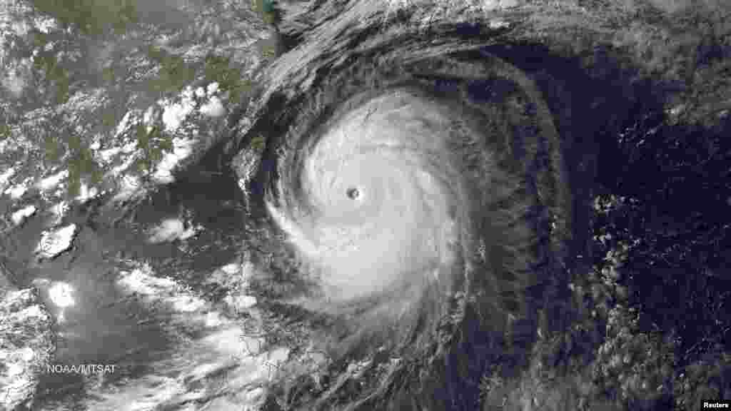 Super Typhoon Neoguri in the Pacific Ocean, approaching Japan on its northward journey, is seen in an image taken by MTSAT-2 satellite on July 7, 2014.