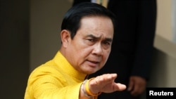 FILE - Thailand's Prime Minister Prayuth Chan-ocha arrives at a weekly Cabinet meeting at Government House in Bangkok, Thailand, May 16, 2016. 