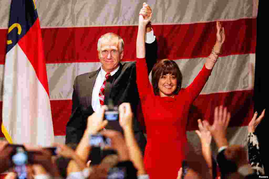 In North Carolina, Republican Thom Tillis and wife Susan celebrate his win over Democrat Kay Hagan in Charlotte early on Nov. 5, 2014.