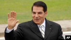 FILE - Then Tunisian President Zine El Abidine Ben Ali waves from his car as he arrives at campaign rally in Rades, outside Tunis, Oct.11, 2009.