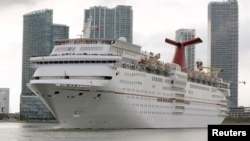 FILE - The Carnival cruise ship Ecstasy leaves the port in Miami, Florida, Sept. 18, 2015.