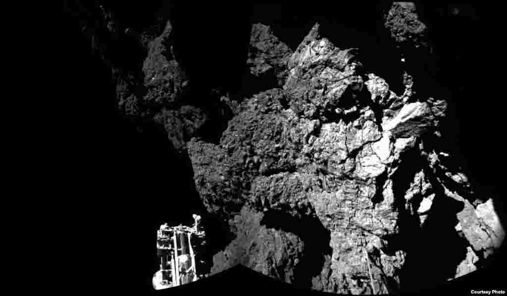 Rosetta’s lander Philae is safely on the surface of Comet 67P/Churyumov-Gerasimenko, as these first two CIVA images confirm. One of the lander’s three feet can be seen in the foreground. The image is a two-image mosaic, Nov. 13, 2014. (Courtesy: European Space Agency, photo released Nov. 13, 2014)