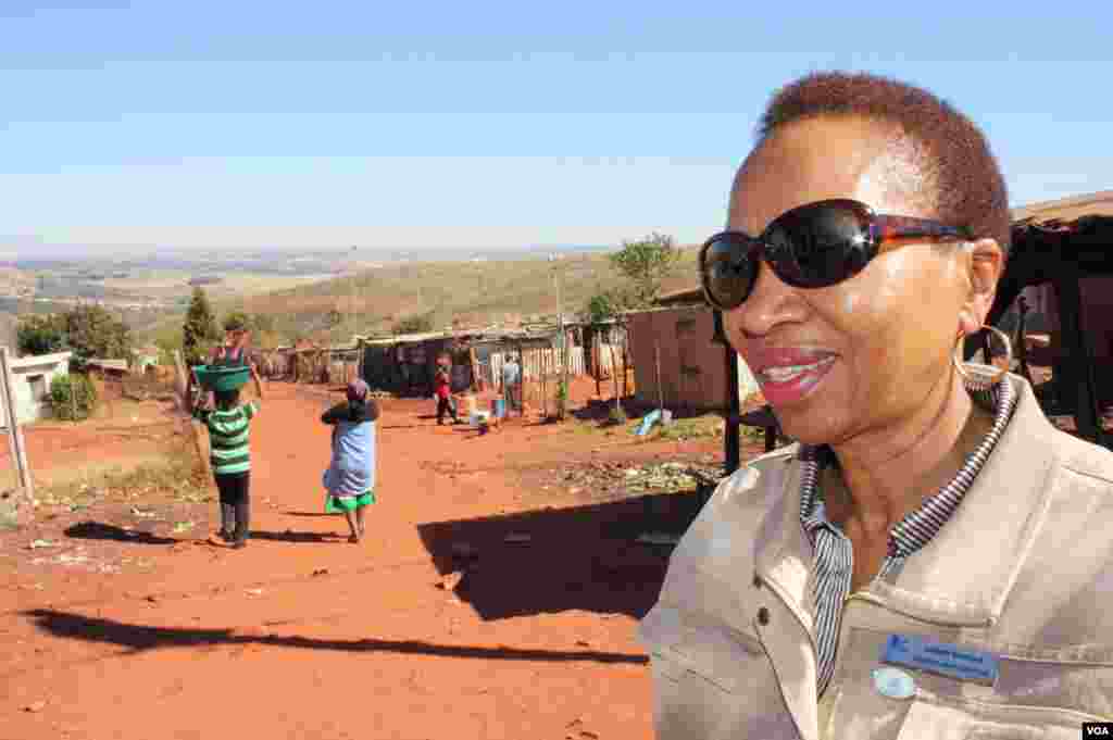 “Sister" Snowy Nkoana has served dying patients in the shanties of Munsieville for more than 40 years. “It’s breaking my heart," she said. "HIV is still very stigmatized here, so some people don’t go to the clinics for the ARVs …I beg them to take their pills…” (VOA / D. Taylor)