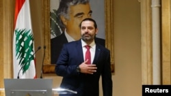 FILE - Lebanon's Prime Minister Saad al-Hariri gestures as he leaves after delivering an address in Beirut, Lebanon, Oct. 29, 2019.