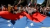 Un grupo de venezolanos participa en una actividad convocada por la candidata presidencial opositora, María Corina Machado. 