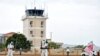 Members of a medical team wearing protective suits clean the airfield to prevent the spread of the coronavirus disease (COVID-19), at the Juba International Airport in Juba, South Sudan, April 5, 2020. 