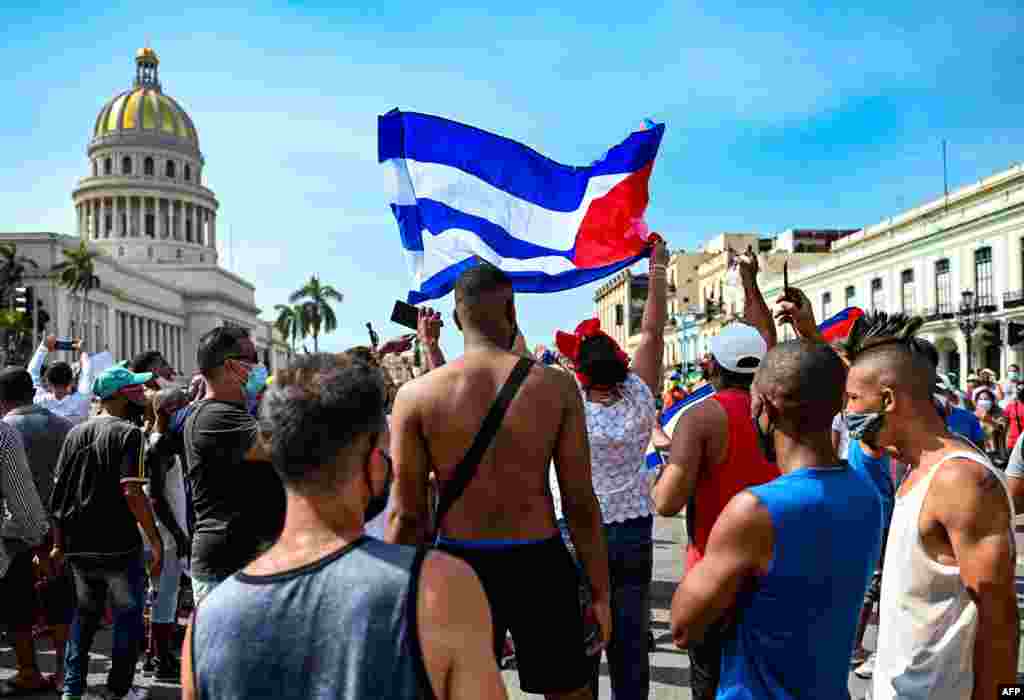 Cubans are seen outside Havana's Capitol during a demonstration against the government of Cuban President Miguel Diaz-Canel in Havana, July 11, 2021.