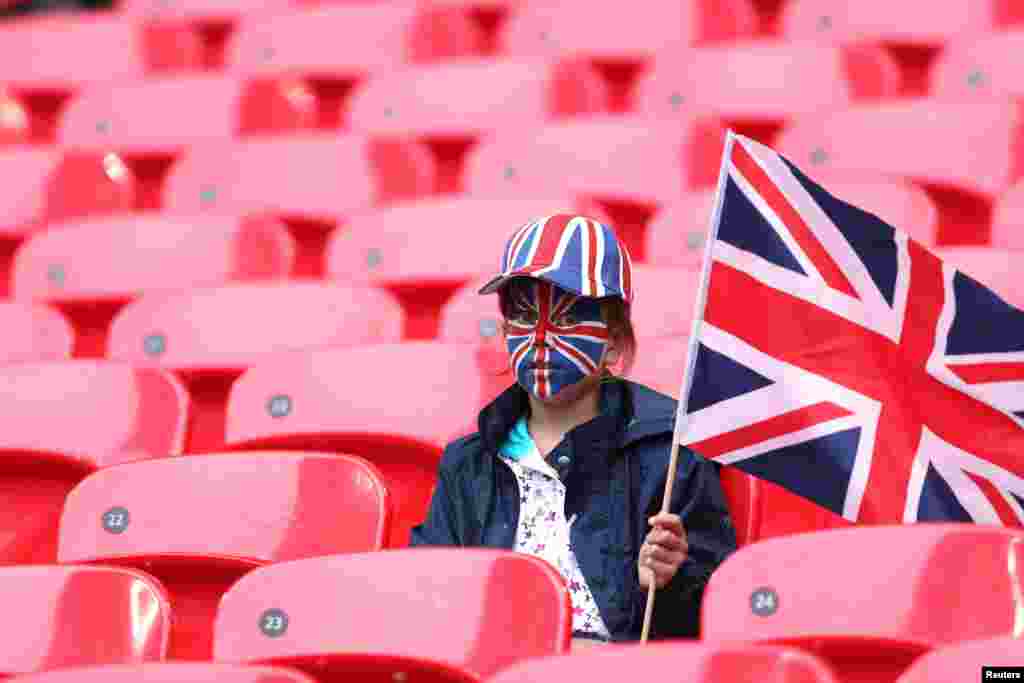 A British fan waits for the Britain - Brazil women's Group E football match at the London 2012 Olympic Games at Wembley Stadium in London July 31, 2012.