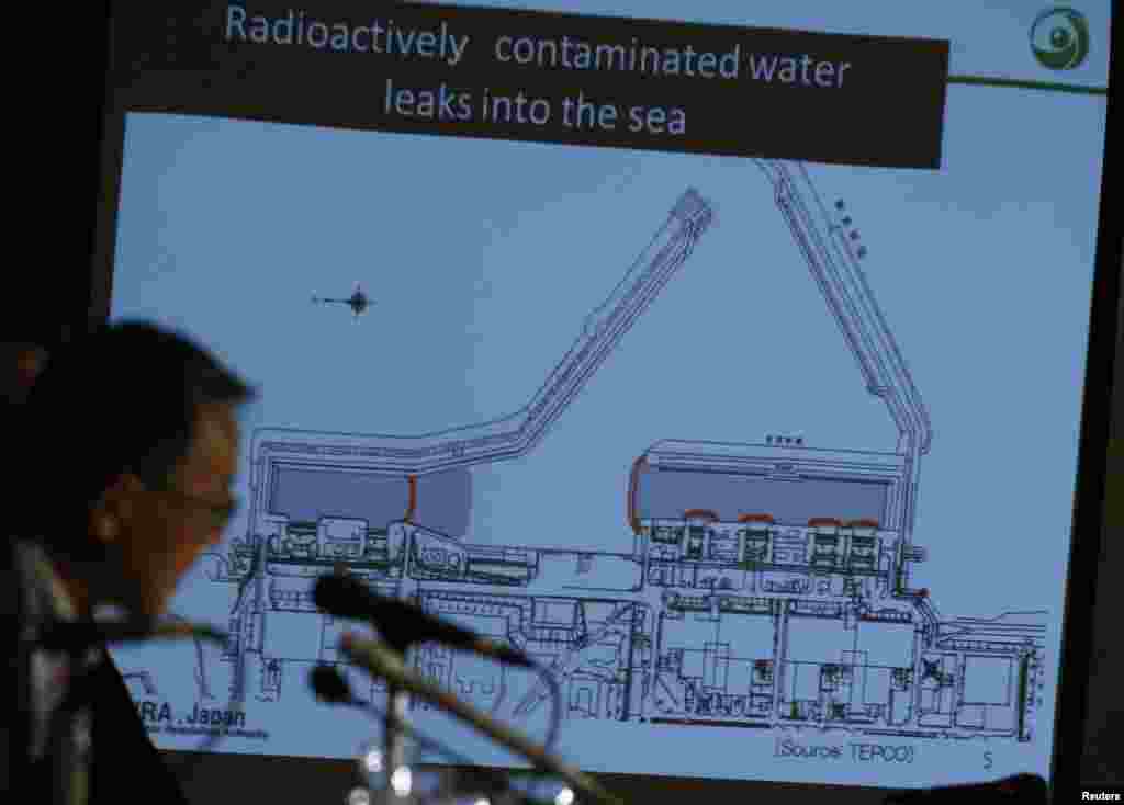 Japan's Nuclear Regulation Authority Chairman Shunichi Tanaka is seen in front of a screen showing the current situation of the contaminated water leakage at Fukushima Daiichi, Sept. 2, 2013.