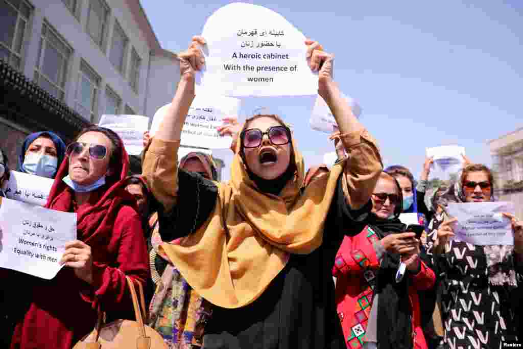 Afghan women's rights defenders and civil activists protest to call on the Taliban for the preservation of their achievements and education, in front of the presidential palace in Kabul, Afghanistan.