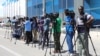 FILE - Reporters are seen during a stake-out in Mogadishu, Somalia, Dec. 29, 2019. The Somali government recently directed journalists to replace the name used for the Islamist extremist group "al-Shabab" with "khawarij," which means "a deviation from Islam."