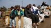 At PK12, the last checkpoint at the exit of the town, thousands of Muslim residents from Bangui and Mbaiki flee the Central African Republic capital Bangui in a mass exodus using cars, pickups, trucks, lorries and motorcycles, escorted by Chadian troops, 