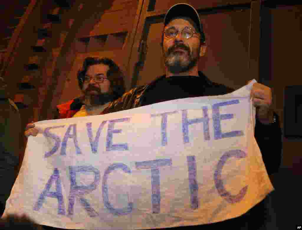 Greenpeace International activists Dima Litvinov of Sweden, right, and Roman Dolgov of Russia pose after being released from a jail in St. Petersburg, Russia.