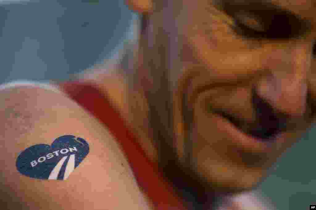 Till T. Teuber of Hamburg, Germany, prepares himself before the 118th Boston Marathon, in Boston, Mass, April 21, 2014.