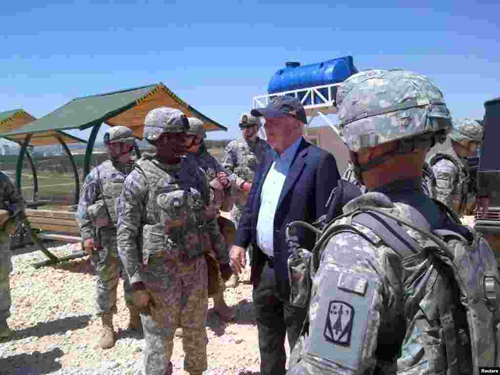 U.S. Senator John McCain meets with U.S. troops in southern Turkey, May 27, 2013. He also visited rebels inside Syria. This picture was released on his Twitter account.