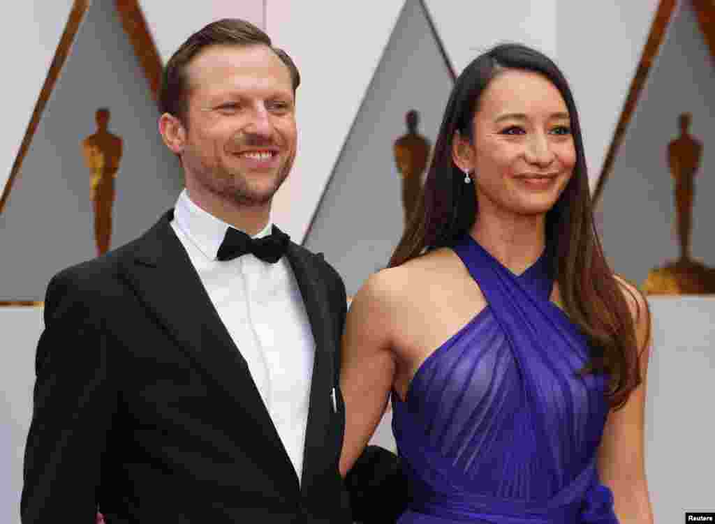 Director Orlando Von Einsiedel and producer Joanna Natasegara of documentary "The White Helmets" pose on the red carpet, Feb. 26, 2017.