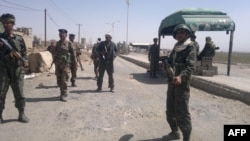 Yemeni soldiers man a checkpoint in Omran province north of Yemen, March 23, 2014. 
