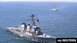 FILE - The U.S. Navy Arleigh Burke-class guided-missile destroyer USS Porter sails in formation during the multinational maritime exercise Sea Breeze 2020, co-hosted by Ukraine and the United States, in the Black Sea, July 25, 2020. 