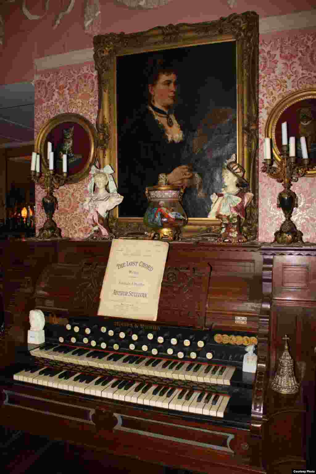 An organ, an anitquie piano and an 1894 mandolin grace the music room. Love says, "It was everybody’s duty to be able to play a musical instrument." Photo by Darren Taylor.